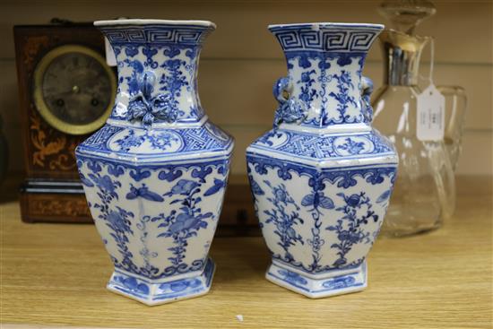 A pair of Chinese blue and white hexagonal vases, 19th century, 20.5cm (a.f.)